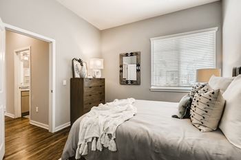 a bedroom with a bed and a dresser and a window  at Grandstone at Sunrise, Arizona, 85383